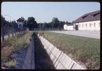 Dachau Concentration Camp : Wall, ditch and fencing near camp's main tourist entry gate