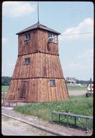 Majdanek Concentration Camp : Guard tower with memorial in the background