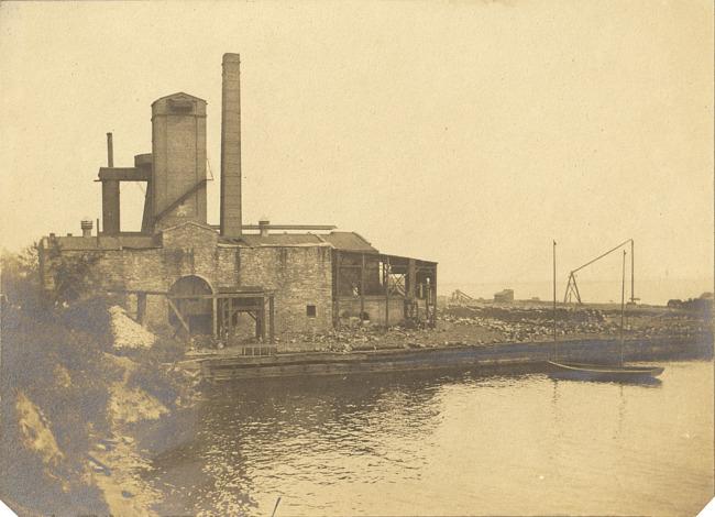Industrial building on shore of lake