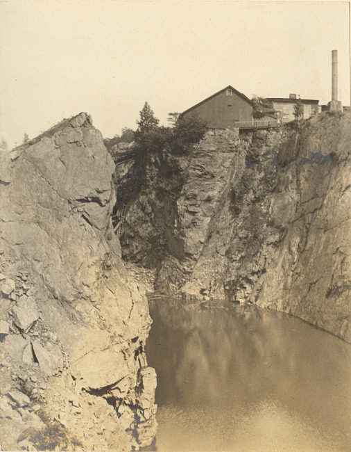 Mining buildings on rocky cliff