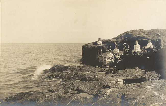 People on rock shoreline of Lake Superior