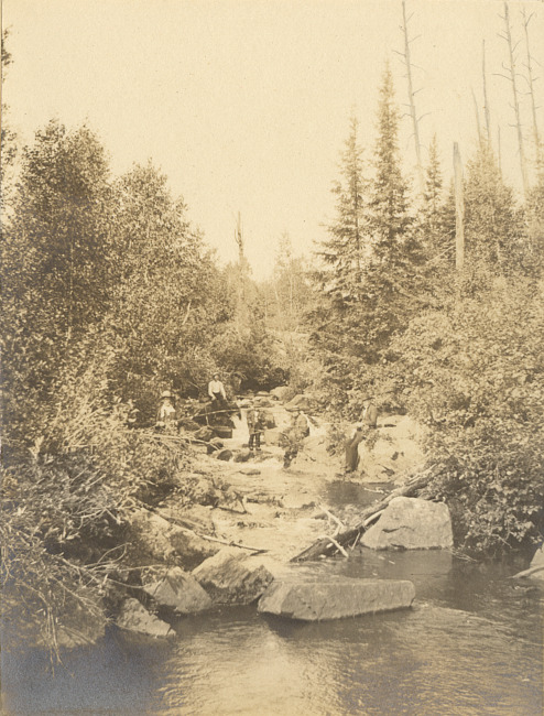 River in the Upper Peninsula with people fishing