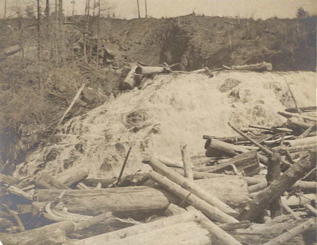 Waterfall in the Upper Peninsula with logs