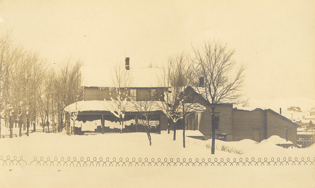 House in winter with laundry on porch