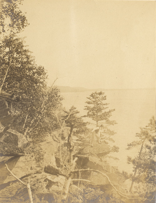 Man on rock shore