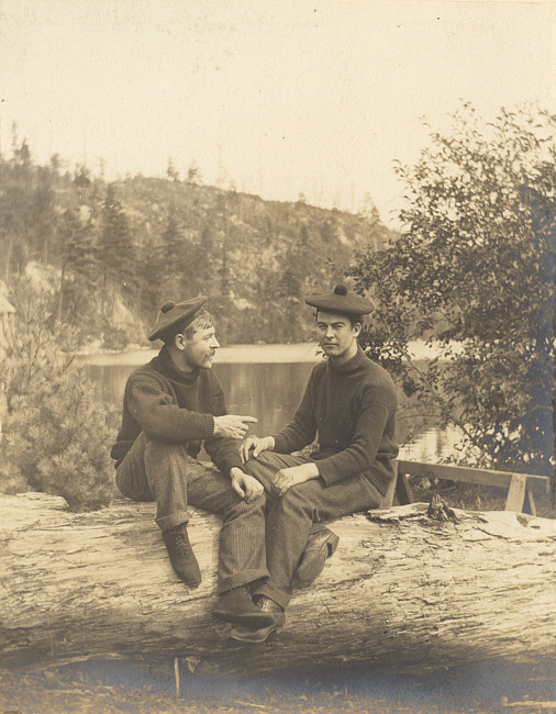 Two men wearing tams