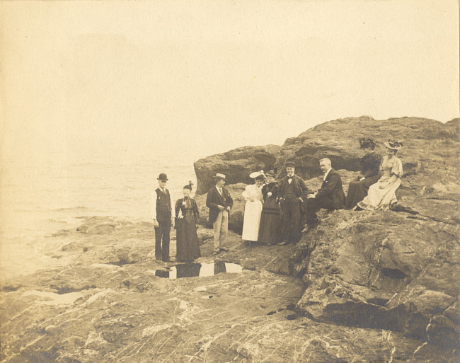 People on rock shoreline of Lake Superior