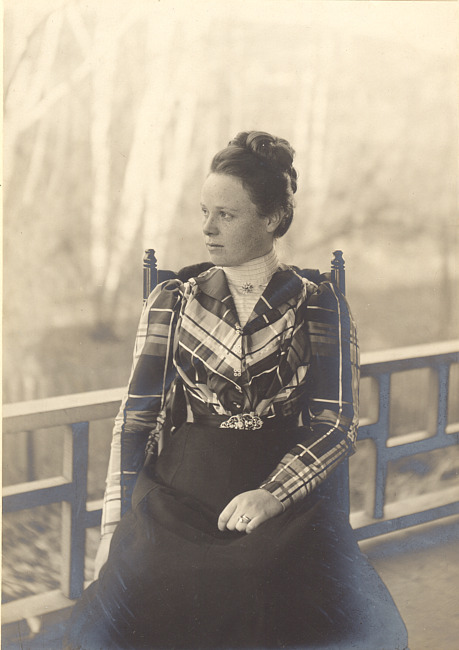 Portrait of a woman wearing a plaid jacket