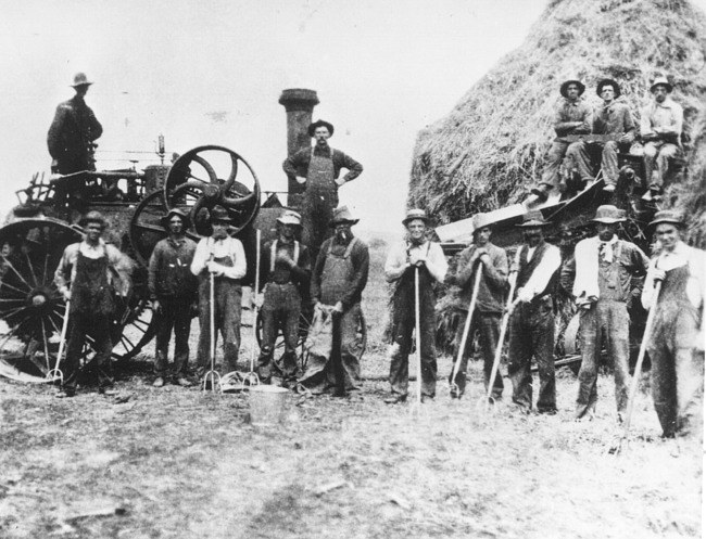 Farm laborers and steam tractor