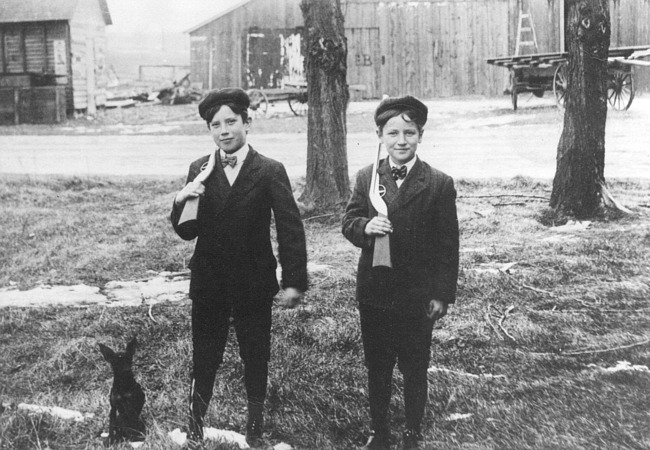 Two young hunters with dog