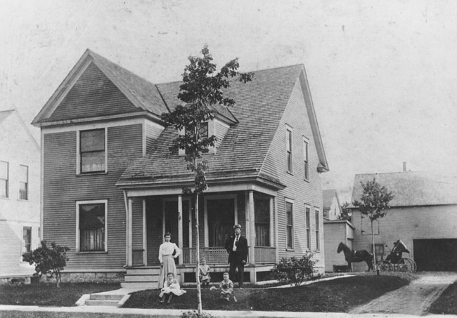 Family in front of Grand Rapids home
