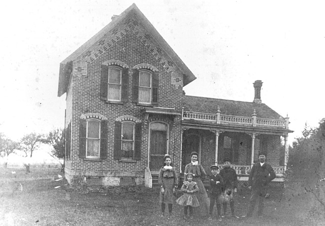 Schaap family in front of house