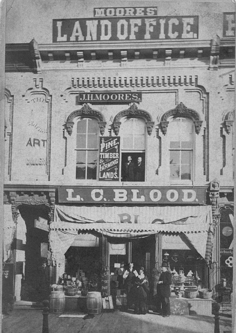 Moores' Land Office and L. C. Blood store, Lansing