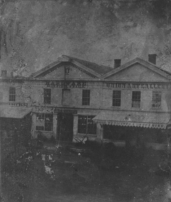 Businesses, 100 Block South Washington, 1858, Lansing