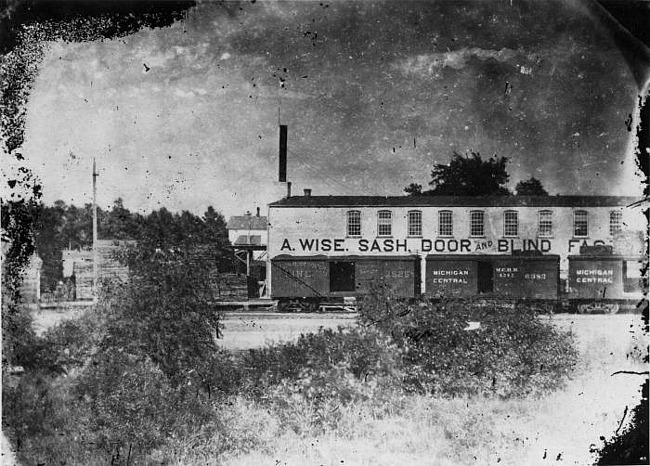 A. Wise, Sash, Door and Blind Factory with railroad cars, Lansing