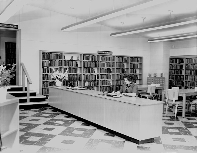 Librarian at fiction desk in Plymouth Library, c.1955