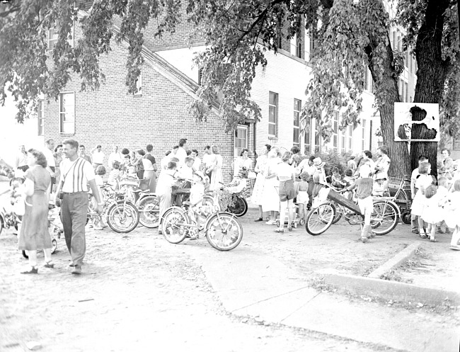 Children gathering on bikes for parade, July 4, 1951