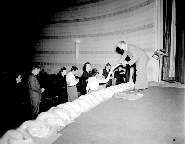Cass Hough on stage at Penn Theater during Christmas Party, 1949