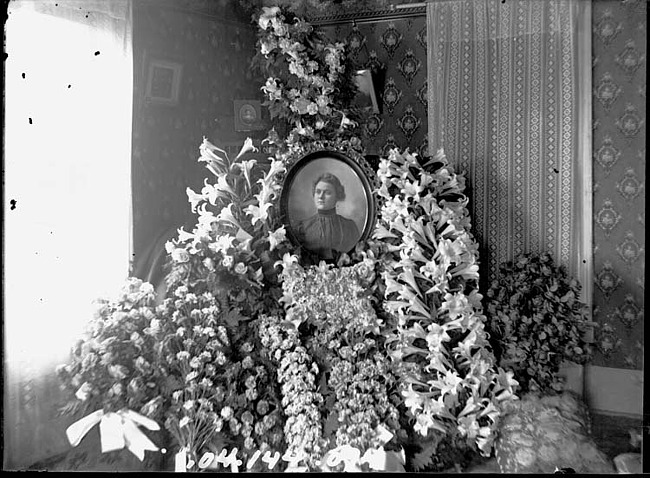 Floral Memorial with Photo of a Woman