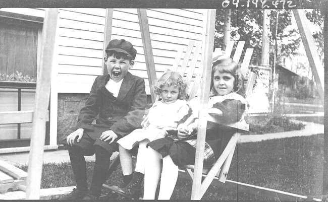 Merrill and Winnie Draper on Swing Set with unidentified girl