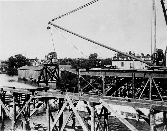 Michigan Avenue Concrete Bridge Under Construction with men working, Lansing