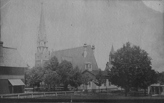 Wide view of Plymouth Congregational Church from neighborhood, Lansing
