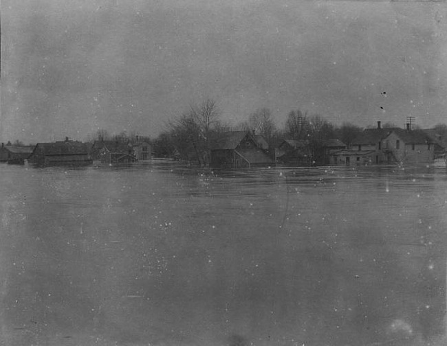 Homes partially submerged by flood, Lansing, 1904