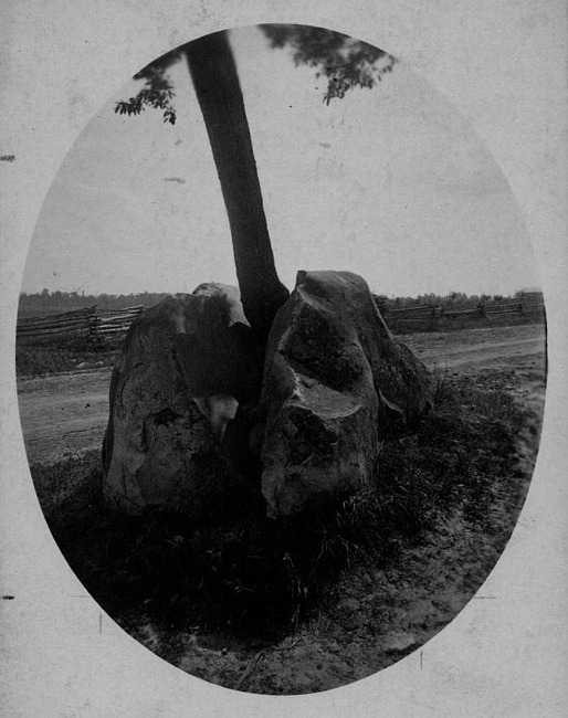 Split Rock with old fence in background, Lansing