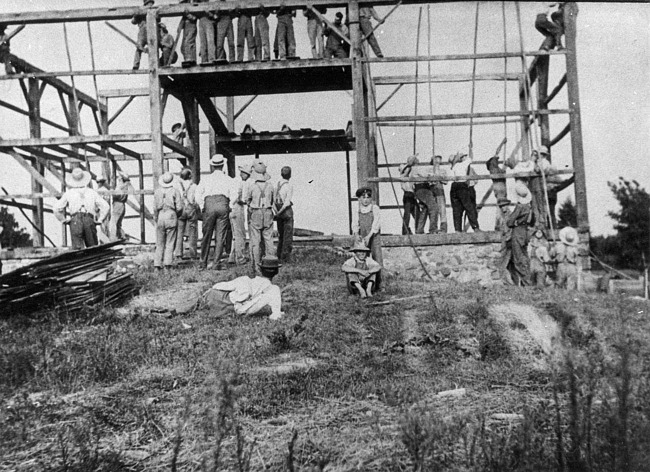 Boys resting while raising the Bowdish barn