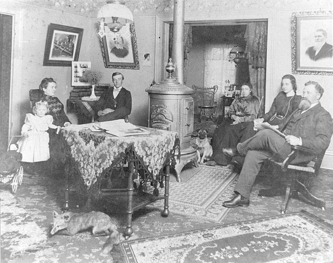 Ives family in parlor