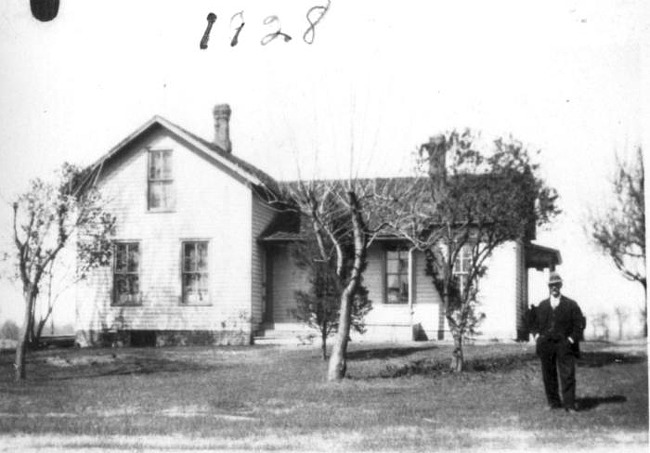 Charles Ahrens and farmhouse