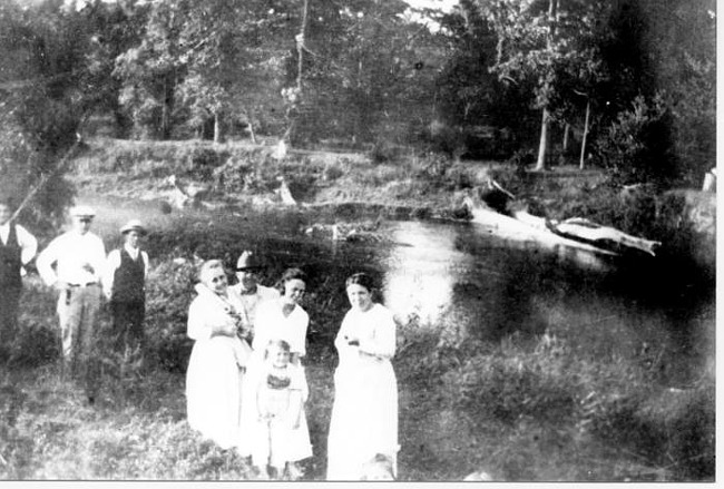 Holzhauer family on bank of Clinton River