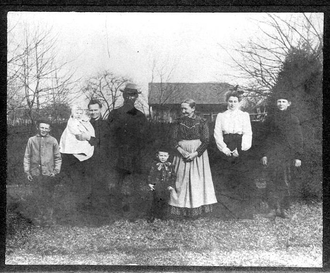 Charles and Louise Ahrens and family, outdoors