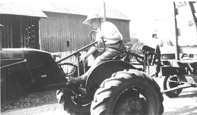 Eleanor Ahrens puts tractor in gear