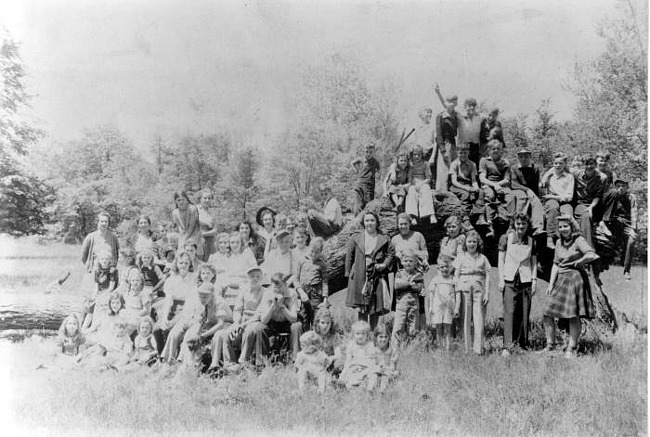 Maple Grove students on fallen tree