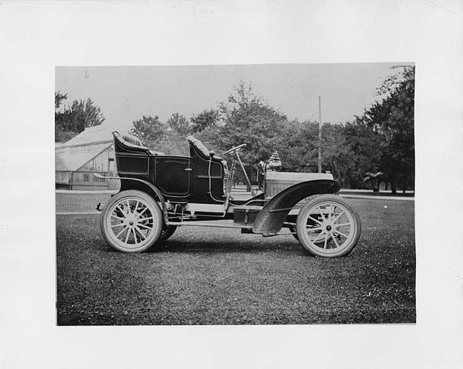 1905 Packard Model N, right side view with greenhouse in background