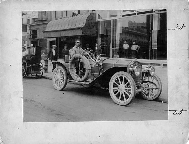 1906 Packard 24 Model S runabout with driver H.B. Joy