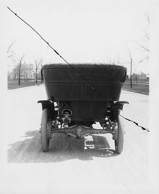 1906 Packard 24 Model S on residential road, back view