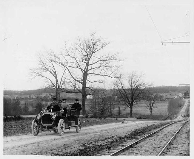 1907 Packard 30 Model U touring car on Woodward Ave. with four male passengers