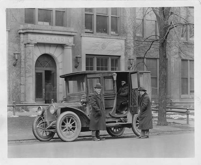 1908 Packard 30 Model UA limousine and owner Mr. Warfolk in front of Packard Company