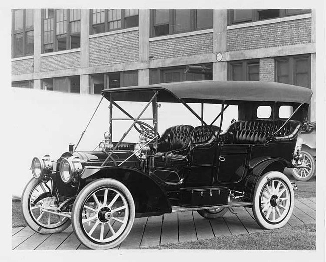 1909 Packard 30 Model UB touring car, left side, brick factory building in background