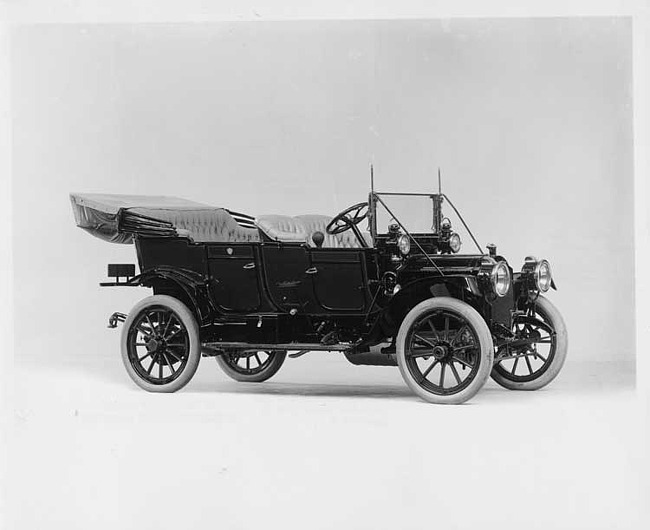 1910 Packard 18 Model NC open car, right side, light-colored upholstery & folding top