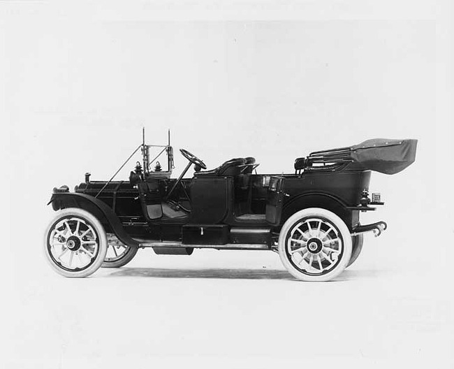 1911 Packard 30 Model UD touring car, three-quarter rear view, left side, top lowered