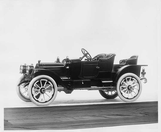 1912 Packard 18 Model NE runabout, five-sixth front view, left side, no top, with rumble seat