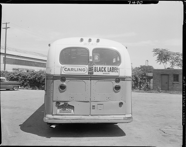 Bus with advertising sign - Carling Black Label Beer