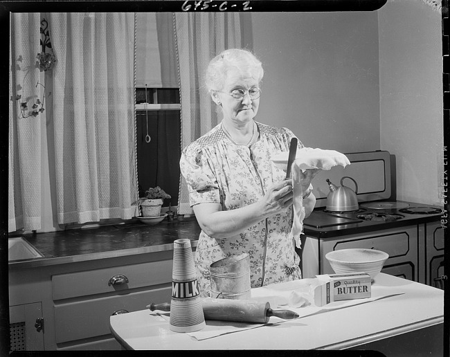 Woman trimming pie