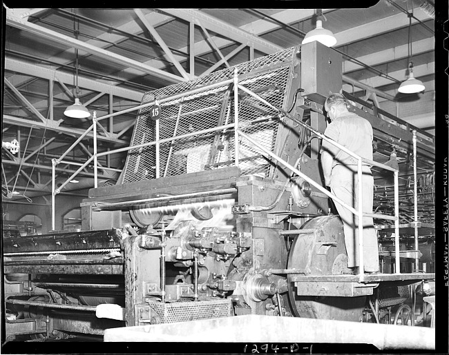 Worker at printing press