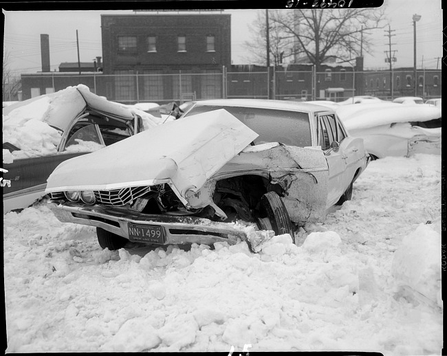 Wrecked automobile in snow