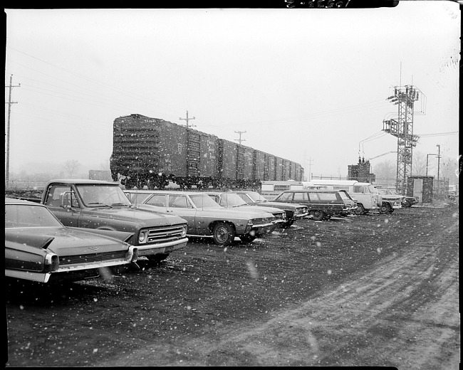 Train and cars in snow