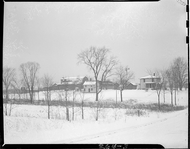 Farmhouse and barns in winter